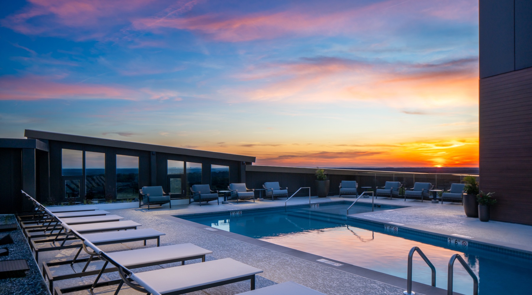 rooftop pool at sunset