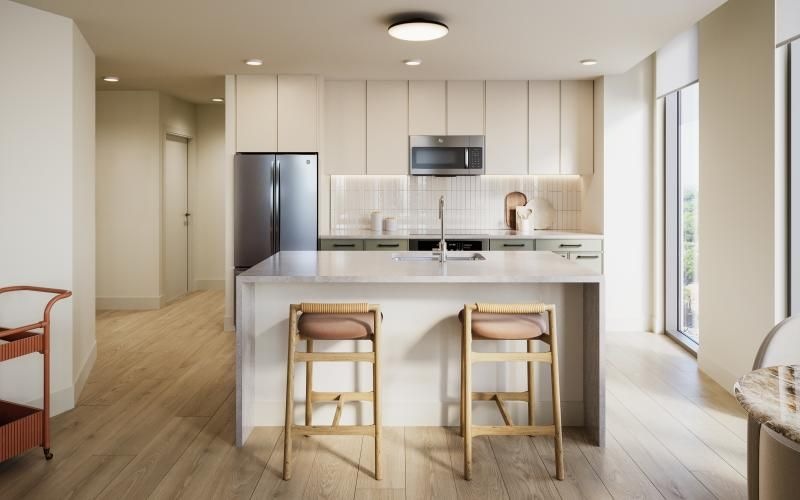 a kitchen with a table and chairs