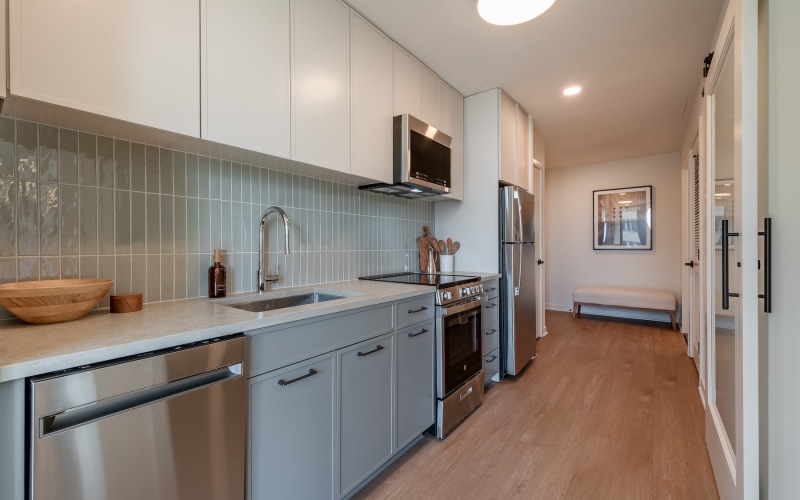 a kitchen with white cabinets